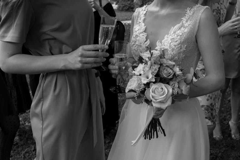 Joyful wedding guests toasting with champagne glasses
